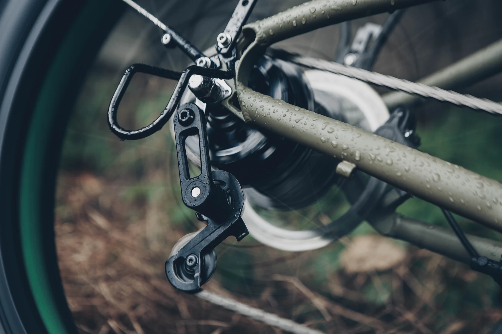 Close-up of the EUNORAU FAT-HD 1.0 Pro rear derailleur, disc brake, and wheel hardware
